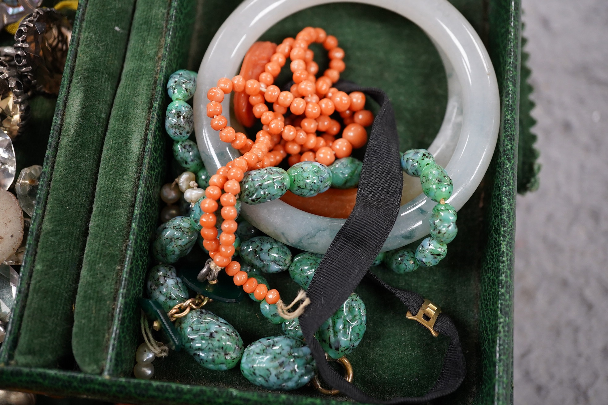 A quantity of assorted mainly costume jewellery in two boxes, including a coral bead necklace. Condition - poor to fair